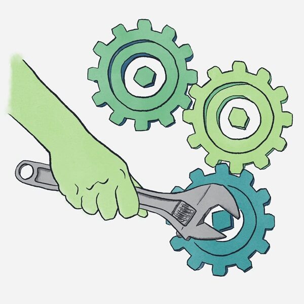 software development concept in green blue hand with wrench turning gears