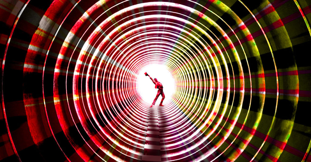 data pipeline illustration man standing at end of ringed tube tunnel red green yellow