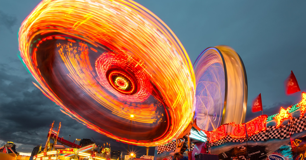 Carnival rides in motion with bright colors
