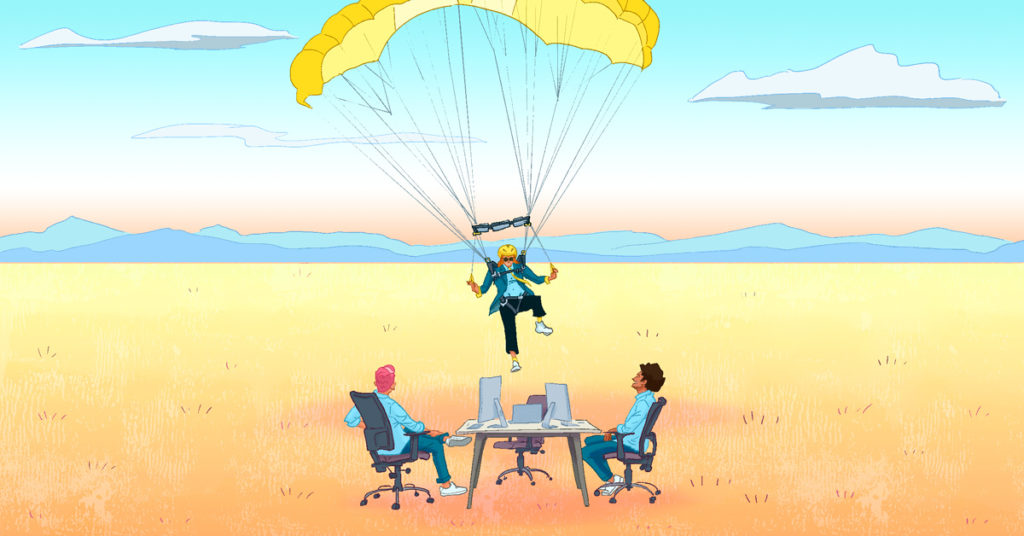 men sitting at desk in field as someone parachutes in to help
