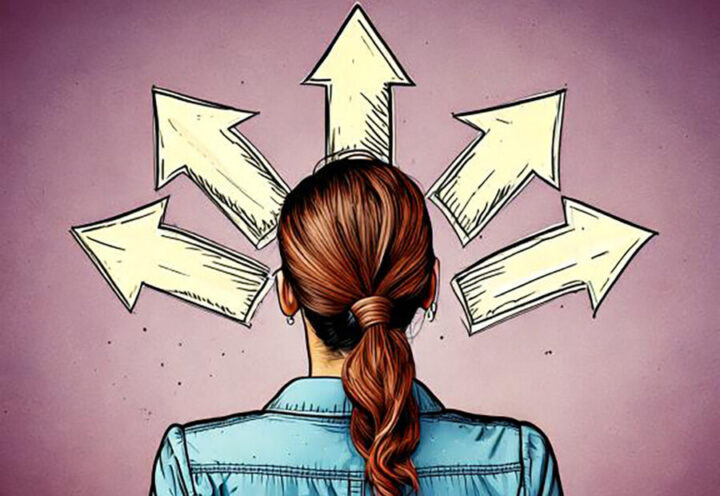 woman with auburn hair and ponytail from back looking up at arrows