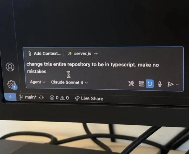 a screenshot of a cursorchat window with the text: "change this entire repository to be in typescript. Make no mistakes."